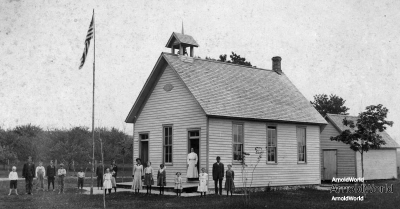 Tracie Balitz, standing third left of teacher, Platte school, circa 1906. Also, Lottie Arnold, white dress just right of teacher; and Ernie Balitz, probably third from left.