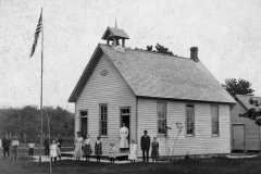 Tracie Balitz, standing third left of teacher, Platte school, circa 1906. Also, Lottie Arnold, white dress just right of teacher; and Ernie Balitz, probably third from left.