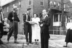 Doris Jane Arnold and firiends holding funeral for a goldfish, perhaps at Owosso Bible College, circa 1950.