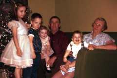 Christmas at Laban's, Joyce, Dan, Gloria, Mike with Grandparents Dan and Tracie. 1960.