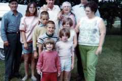 Laban Arnold with wife and six kids, brother Allen, and parents Dan and Tracie.