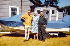 Allen, Daniel and Tracie Arnold by their boat on the old Arnold Homestead, July 1970.