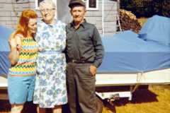 Eleanor, Daniel and Tracie Arnold by their boat on the old Arnold Homestead, July 1970.