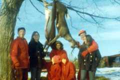 Daniel Arnold, Joyce's friend Chris, Dan, Mike, Gloria, Joyce and Allen Arnold. Deer season, three deer and two fox taken, Arnold homestead, November 1970.