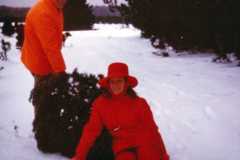 Allen and Eleanor Arnold bringing in the Christmas tree at the old Arnold homestead, December 1970.