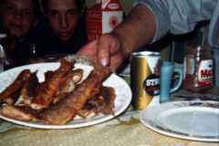 Laban Arnold Showing plate of trout as Mike and Dan look on, April 1971.