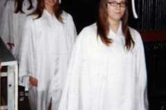 Joyce followed by Chris Ehret (marching in) commencement night, LC Walker Arena, June 1971.