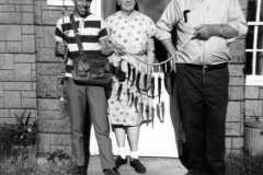Dan, Grandma Tracie, Laban Arnold with trout, 1971.