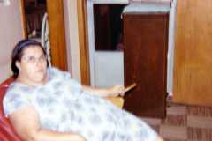 Me (Doris) holding popsicle stick (caught unaware), July 1971.
