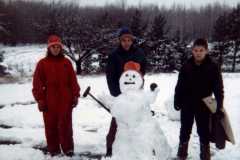 Gloria, Dan, and Mike Arnold with a deer season snowman, November 1971.
