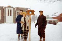 Tracie, Eleanor, and Daniel Arnold, maybe a new bird feeder for the old Arnold homestead, December 1970.