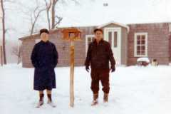 Tracie and Daniel Arnold, maybe a new bird feeder for the old Arnold homestead, December 1970.