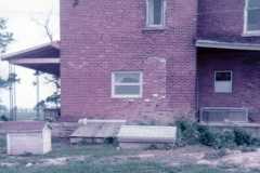 Back of house and old cellar door at Doris Moore old house. Kenton Ohio, September 1977.