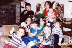 Valerie with all the Arnold grandkids, but Gina, Christmas 1985.