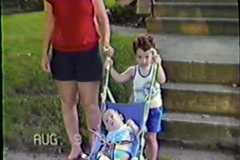 Peggy, Dave and Steve, stroller ride, August 1986.