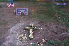 Children of Laban Arnold and Doris Moore meet at Platte Cemetery to hold burial service, September 2002.